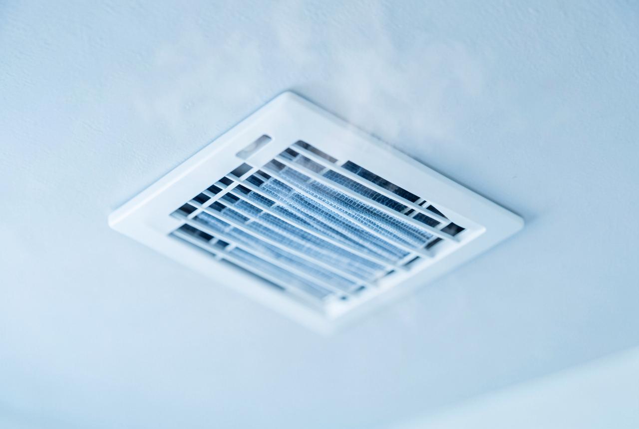 Clean ceiling air vent register in a bright home